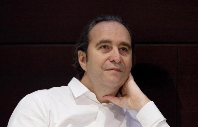Xavier Niel, le patron d'Iliad, maison-mère de Free, à Paris le 31 août 2012. Xavier Niel, le patron d'Iliad, maison-mère de Free, à Paris le 31 août 2012.