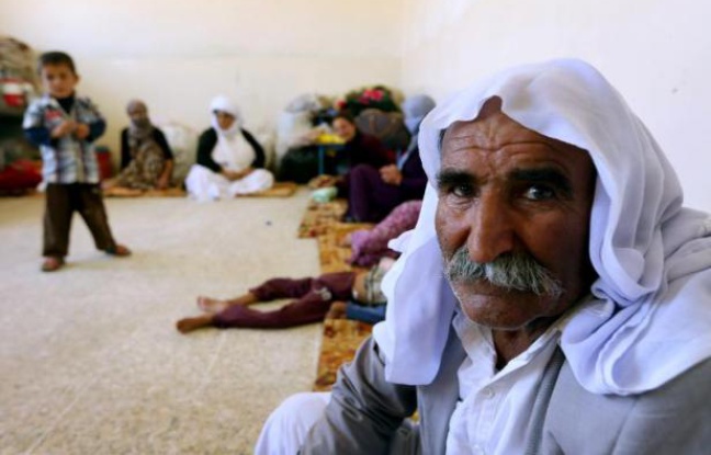 Une famille yazidie qui a fui la violence de son village de Sinjar en Irak, réfugiée dans une école au Kurdistan, le 5 août 2014 Une famille yazidie qui a fui la violence de son village de Sinjar en Irak, réfugiée dans une école au Kurdistan, le 5 août 2014