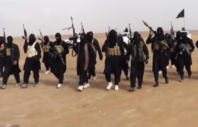 Photo prise à partir d'une vidéo de propagande diffusée par l'Etat islamique en Irak et au Levant (EIIL), le 11 juin 2014, et montrant un groupe de combattants réunis dans la province de Ninive en Irak Photo prise à partir d'une vidéo de propagande diffusée par l'Etat islamique en Irak et au Levant (EIIL), le 11 juin 2014, et montrant un groupe de combattants réunis dans la province de Ninive en Irak