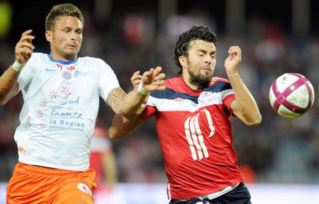 Le Montpelliérain Olivier Giroud (à gauche) à la lutte avec le Liloois Marko Basa, le 14 août 2011, au Stadium Nord. Le Montpelliérain Olivier Giroud (à gauche) à la lutte avec le Liloois Marko Basa, le 14 août 2011, au Stadium Nord.