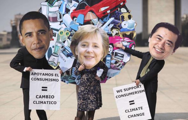 Des activistes écologistes au sommet de Cancun, représentant Barack Obama, Angela Merkel et le premier ministre japonais Naoto Kan, le 01 décembre 2010. Des activistes écologistes au sommet de Cancun, représentant Barack Obama, Angela Merkel et le premier ministre japonais Naoto Kan, le 01 décembre 2010.