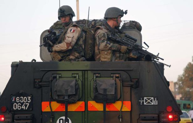 French troops in two armored personnel carriers drive through Mali's capital Bamako on the road to Mopti Tuesday Jan. 15, 2013. French forces led an all-night aerial bombing campaign Tuesday to wrest control of a small Malian town from armed Islamist extremists who seized the area, including its strategic military camp. A a convoy of 40 to 50 trucks carrying French troops crossed into Mali from Ivory Coast as France prepares for a possible land assault. Several thousand soldiers from the nations neighboring Mali are also expected to begin arriving in coming days. (AP Photo/Jerome Delay)/XJD114/546739146594/1301152026 French troops in two armored personnel carriers drive through Mali's capital Bamako on the road to Mopti Tuesday Jan. 15, 2013. French forces led an all-night aerial bombing campaign Tuesday to wrest control of a small Malian town from armed Islamist extremists who seized the area, including its strategic military camp. A a convoy of 40 to 50 trucks carrying French troops crossed into Mali from Ivory Coast as France prepares for a possible land assault. Several thousand soldiers from the nations neighboring Mali are also expected to begin arriving in coming days. (AP Photo/Jerome Delay)/XJD114/546739146594/1301152026