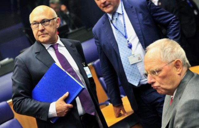 Le ministre français des Finances Michel Sapin (g) et son homologue allemand Wolfgang Schauble à une réunion de l'Eurogroupe le 19 juin 2014 au siège de l'Uion européenne au Luxembourg Le ministre français des Finances Michel Sapin (g) et son homologue allemand Wolfgang Schauble à une réunion de l'Eurogroupe le 19 juin 2014 au siège de l'Uion européenne au Luxembourg