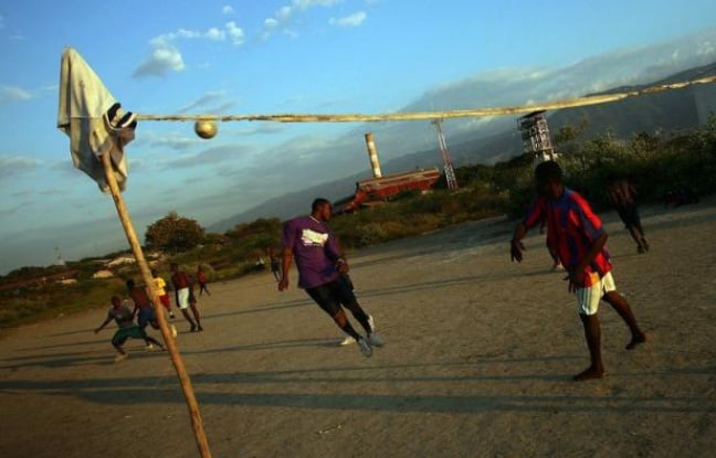 A group of youths play soccer on a small field beside the sea in the Port-au-Prince slum of Cite Soleil on April 18, 2011. They meet every evening to play, to take advantage of good weather before the rains come, they said. AFP PHOTO/Hector Retamal A group of youths play soccer on a small field beside the sea in the Port-au-Prince slum of Cite Soleil on April 18, 2011. They meet every evening to play, to take advantage of good weather before the rains come, they said. AFP PHOTO/Hector Retamal