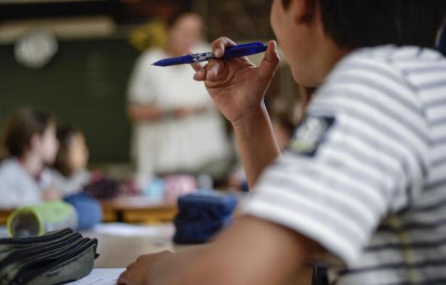 Un élève d'une école primaire le jour de la rentrée scolaire le 2 septembre 2014 à Paris Un élève d'une école primaire le jour de la rentrée scolaire le 2 septembre 2014 à Paris