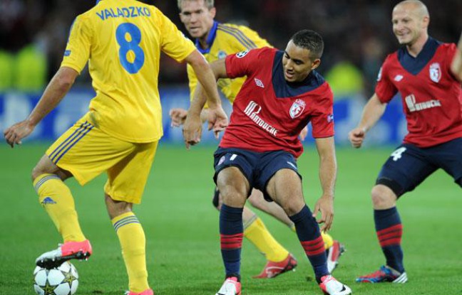 Les Lillois Payet et Balmont contre le BATE Borisov, lors de la première journée de la Ligue des champions, le 19 septembre 2012, à Villeneuve d'Ascq. Les Lillois Payet et Balmont contre le BATE Borisov, lors de la première journée de la Ligue des champions, le 19 septembre 2012, à Villeneuve d'Ascq.
