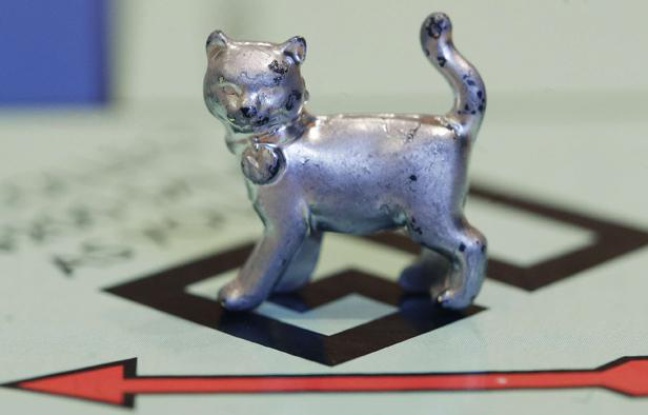 In this Tuesday, Feb. 5, 2013 file photo, the newest Monopoly token, a cat, rests on the game board at Hasbro Inc. headquarters, in Pawtucket, R.I. Hasbro is reporting their fourth quarter 2012 earnings on Thursday, Feb. 7, 2013. In this Tuesday, Feb. 5, 2013 file photo, the newest Monopoly token, a cat, rests on the game board at Hasbro Inc. headquarters, in Pawtucket, R.I. Hasbro is reporting their fourth quarter 2012 earnings on Thursday, Feb. 7, 2013.