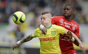 Le Nantais Adryan face au Montpelliérain William Rémy. AFP / JEAN-SEBASTIEN EVRARD