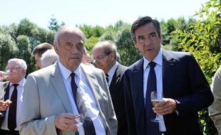 Le maire d'Epinal Michel Heinrich, en compagnie de François Fillon, à Etival-Clairefontaine, en 2012.