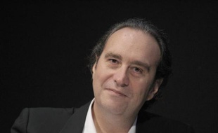 Xavier Niel, fondateur de Free (Iliad), lors d'une conférence de presse le 10 mars 2014 au siège du groupe à Paris