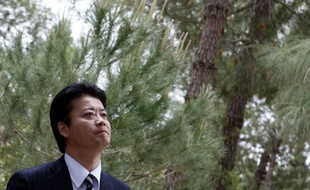 Japanese Foreign Minister Koichiro Gemba visits the Yad Vashem garden where a tree in memory of Sempo Sugihara, a Japanese who saved the lives of several thousand Lithuanian Jews during World War II, was planted in his memory during the former's visit to the Yad Vashem Holocaust Memorial museum in Jerusalem on May 2, 2012. AFP PHOTO/GALI TIBBON