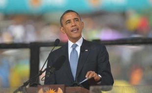 US President Barack Obama gives an address during South African former president Nelson Mandela's memorial service at the FNB Stadium (Soccer City) in Johannesburg on December 10, 2013. Mandela, the revered icon of the anti-apartheid struggle in South Africa and one of the towering political figures of the 20th century, died in Johannesburg on December 5 at age 95. AFP PHOTO / ALEXANDER JOE