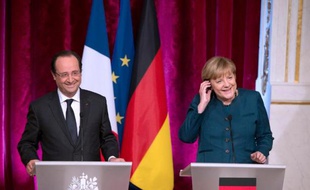 Le président français François Hollande et la chancelière allemande Angela Merkel à l'Elysée, le 18 décembre 2013