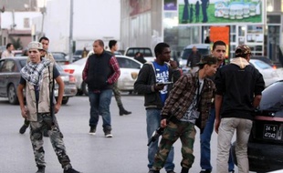 Assaillies de revendications de toutes parts, les nouvelles autorités libyennes peinent à régler la question des milices, en charge d'une grande partie de la sécurité du pays depuis la guerre et qui réclament désormais d'être représentées dans les instances dirigeantes.