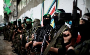 Des combattants des brigades Ezzedine al-Qassam lors des funérialles d'un de leur responsable, le 22 novembre 2012 à Gaza