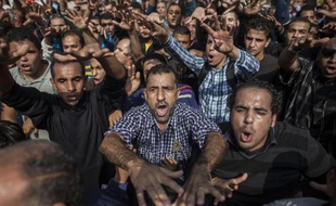 Le chef d'Etat islamiste destitué Mohamed Morsi a martelé qu'il était le président légitime d'Egypte, à l'ouverture lundi sous haute sécurité de son procès au Caire, ajourné au 8 janvier.