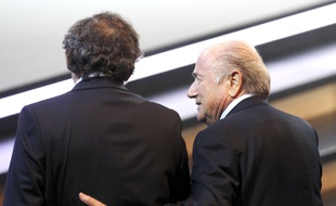 Swiss FIFA President Joseph Blatter, right, and French UEFA President Michel Platini walk together at the 61st FIFA Congress in Zurich, Switzerland, Wednesday, June 1, 2011. (AP Photo/Michael Probst)/PZUR119/1106011452