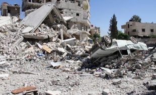 A picture shows destruction in Sbeneh, south of the Syrian capital Damascus, on June 16, 2013. More than 70 Syrian military officers have defected to the opposition and crossed into Turkey, an official there said, as world leaders prepared to discuss the Syrian conflict at the G8 summit. AFP PHOTO/WARD AL-KESWANI