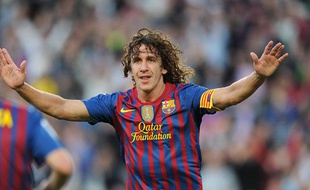 Carles Puyol le 3 mai 2012, montre sa joie après avoir marqué un but contre Malaga au Camp Nou.