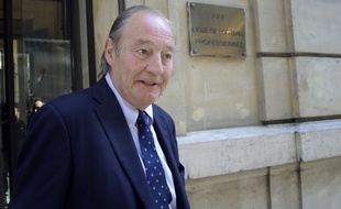 Lens' Ligue 2 football club President Gervais Martel leaves after an hearing by the DNCG (Direction nationale du controle de gestion), the financial branch of the Ligue de Football Professionnel (French National Professional Football players Union) in Paris on June 10, 2015. Relegated to Ligue 2 but threatened to plunge even lower by the errors of his Azerbaijani owner, RC Lens plays its future today at the DNCG, financial policeman of French football. AFP PHOTO / THOMAS OLIVA