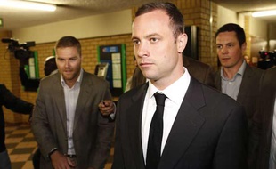 Oscar Pistorius arrive au tribunal de Pretoria, le 3 mars 2014.