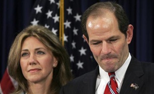New York Governor Eliot Spitzer addresses the media with his wife Silda Wall Spitzer at his office in New York, March 11, 2008. Spitzer apologized to his family for a "private matter" on Monday but made no reference to a New York Times report that he may have been linked to a prostitution ring. "I failed to live up to the standards I set up to myself. Now I stand to regain the trust of my family," Spitzer told a packed room of reporters in New York City. He said nothing about possibly resigning. He said nothing about possibly resigning. REUTERS/Shannon Stapleton (UNITED STATES)