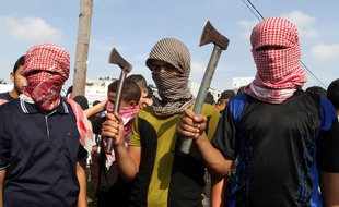 Palestinians take part in an anti-Israel protest in the southern Gaza Strip town of Rafah on October 13, 2015, as a wave of stabbings has hit Israel, Jerusalem and the West Bank along with violent protests in annexed east Jerusalem and the occupied West Bank, leading to warnings that a full-scale Palestinian uprising, or third intifada, could erupt. The unrest has also spread to the Gaza Strip, with clashes along the border in recent days leaving nine Palestinians dead from Israeli fire. Photo by Abed Rahim Khatib/APAIMAGES_123401/Credit:APA IMAGES/SIPA/1510131239
