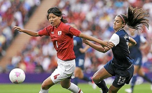 Japan's Saki Kumagai, left, and United States' Alex Morgan vie for the ball during the women's soccer gold medal match at the 2012 Summer Olympics, Thursday, Aug. 9, 2012, in London. (AP Photo/Ben Curtis)/OSOC443/726333595076/1208092125