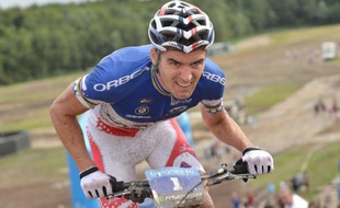 French Julien Absalon of team Orbea rides his bike for first place during the final stage of the Belgacom Belgian MTB Grand Prix, in Boom August 4, 2012. AFP PHOTO / BELGA PHOTO / DAVID STOCKMAN