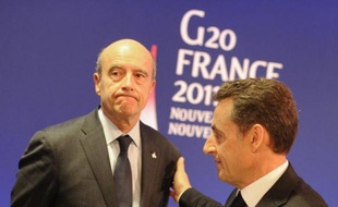 L'ancien président français Nicolas Sarkozy et son ex ministre des Affaires étrangères Alain Juppé, le 3 novembre 2011, lors d'un Sommet à Cannes