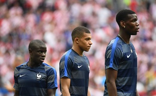 Paul Pogba, Kylian Mbappé, N'Golo Kanté le 15 juillet 2018 lors de la finale du Mondial.AFP PHOTO / Jewel SAMAD