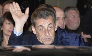 Nicolas Sarkozy, élu président de l'UMP, quittant le siège de son parti à Paris le 29 novembre 2014