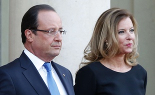 FILE - In this Sept. 3, 2013 file photo, French president Francois Hollande and his companion Valerie Trierweiler wait for German President Joachim Gauckand, at the Elysee Palace, in Paris. Trierweiler' s book "Merci pour ce moment" (Thanks for this moment) relates her life at the presidential palace and will go on sale Thursday. (AP Photo/Jacques Brinon, File)/PAR107/649826630427/SEPT 3, 2013 FILE PHOTO/1409031110