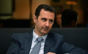 Le président syrien Bashar al-Assad durant une interview accordée au magazine parisien Paris Match à Damas le 4 décembre 2014