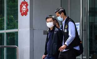 Arrestation du rédacteur en chef du quotidien Apple Daily Ryan Law, jeudi 17 juin à Hong Kong.