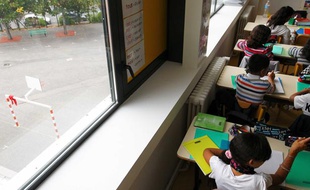 Illustration: Des élèves en classe de primaire.