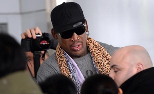 Dennis Rodman à son arrivée de Pyongyang, à l'aéroport de Pékin, le 23 décembre 2013.
