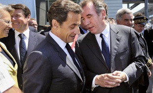 France's President Nicolas Sarkozy (foreground) accompanied by Centrist MoDem party leader Francois Bayrou (R), Justice Minister Michele Alliot-Marie (L) and Industry Minister Christian Estrosi (2ndL) visit French helicopter engine manufacturer Turbomeca new plant in Bordes, southwestern France, on June 22, 2010. Turbomeca, a branch of the French aerospace and defence industries group Safran, is the world leader for helicopter turbines. AFP PHOTO POOL PHILIPPE WOJAZER