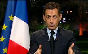 France's President Nicolas Sarkozy, in this video image taken from France2 television in Paris, appears on live prime time news to speak to the nation from the Elysee Palace after a meeting with union members and employers' representatives February 18, 2009. REUTERS/FRANCE2 TV/HO (FRANCE)