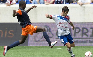 Yoann Gourcuff (à doite) et Henri Bedimo lors du match OL-Montpellier du Trophée des champions, le 28 juillet 2012.