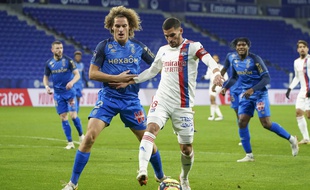 LIGUE 1 2021-2022 Championnat de France de football - Page 12 310x190_lyon-s-houssem-aouar-left-and-reims-wout-faes-fight-for-the-ball-during-the-french-league-one-soccer