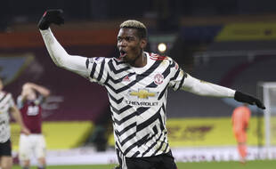 Manchester United's Paul Pogba celebrates after scoring during the English Premier League soccer match between Burnley and Manchester United in Burnley, England, Tuesday, Jan. 12, 2021. Manchester won the match 1-0.(Clive Brunskill/Pool via AP)/XLP264/21012813355391/POOL PHOTO/2101122339