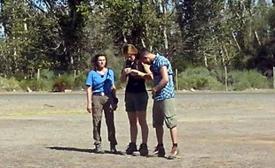 This picture taken on March 9, 2015 in the Argentine province of La Rioja shows the three French sports stars (from L) Champion sailor Florence Arthaud, Olympic gold medallist swimmer Camille Muffat, and Olympic boxer Alexis Vastine, moments before they enters a helicopter that crashed while filming a reality TV show. Arthaud, Muffat and Vastine were among 10 people killed when two helicopters filming the survival series "Dropped" smashed into each other in the rugged mountains of La Rioja province, local officials said. AFP PHOTO / ALDO PORTUGAL
***BEST QUALITY AVAILABLE***