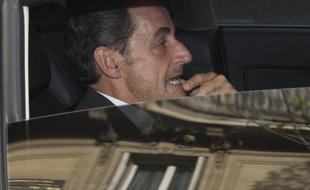 Nicolas Sarkozy à la sortie de son bureau le 19 septembre 2014 à Paris