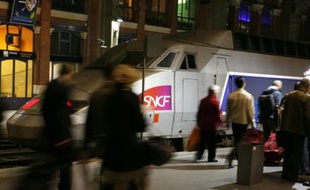 Commuters board the last TGV high speed train to Paris before a strike by French SNCF railway workers at the Lille-Flandres station, northern France, October 17, 2007. French transport workers began a 24-hour nationwide strike late on Wednesday over planned pension changes, a first test of President Nicolas Sarkozy's resolve to carry out the reform agenda on which he was elected.