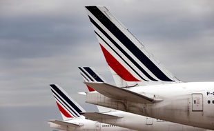 A photograph taken on November 25, 2020 shows Air France planes parked in Roissy airport, northern Paris. (Photo by Thomas COEX / AFP)