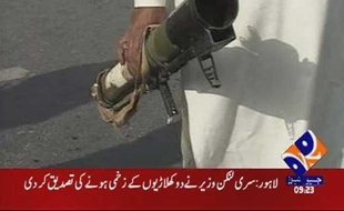 A video grab shows a man holding a rocket launcher after an attack by unidentified gunmen in Lahore March 3, 2009. Six members of the Sri Lankan cricket squad were wounded when around a dozen gunmen attacked their bus as it drove under police escort on Tuesday to a stadium in the Pakistani city of Lahore, witnesses and officials said. REUTERS/GEO via Reuters TV (PAKISTAN). PAKISTAN OUT. NO COMMERCIAL OR EDITORIAL SALES IN PAKISTAN.