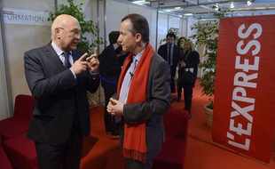 Michel Sapin et Christophe Barbier, directeur de la rédaction de l'Express, le 21 mars 2014, à Paris.