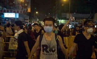 Des manifestants prodémocratie le 5 octobre 2014 dans le quartier Mongkok à Hong Kong