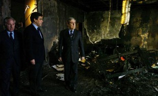 France's Prime Minister Francois Fillon (2nd L) and Ange Santini (C), speaker of the executive council of Corsican Territorial Assembly, and the speaker Camille de Rocca (L) view the remains of Santini's office after a fire was set on Saturday by Corsican nationalist militants who occupied the building, during Fillon's visit to Ajaccio January 14, 2008. REUTERS/Pierre Murati (FRANCE)